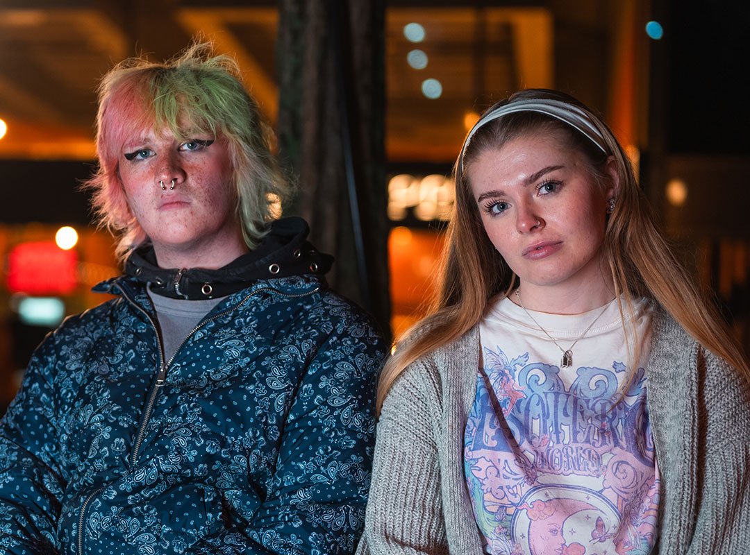 Two students looking into the camera