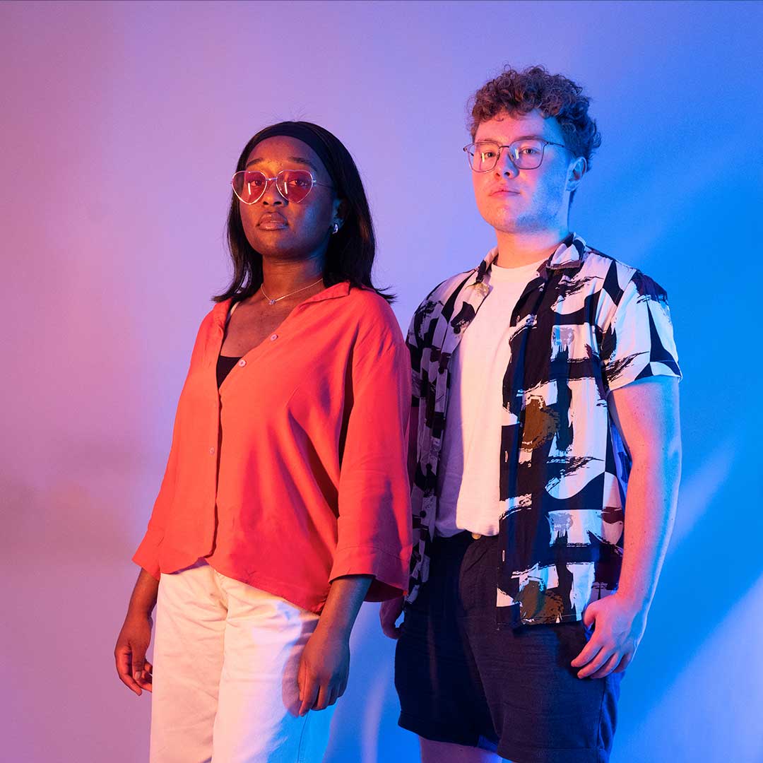 Two students looking at the camera looking serious