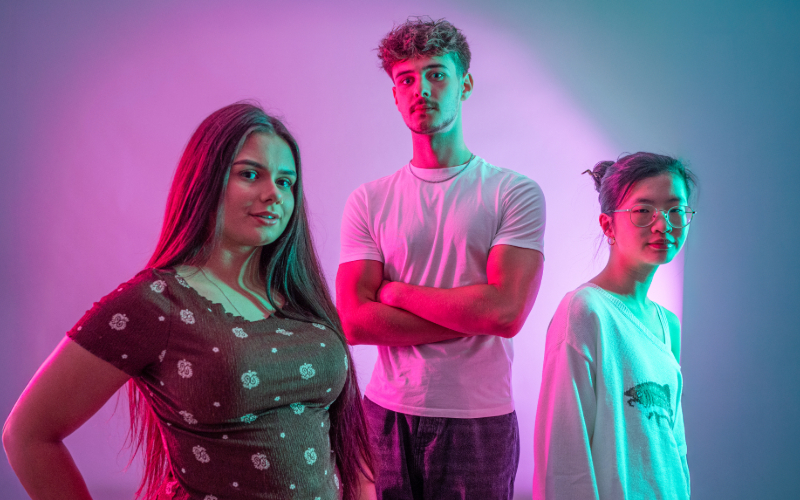 A student wearing a white turtleneck and a long white blazer