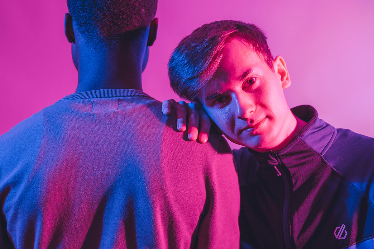 Student resting their head on another student's shoulder.