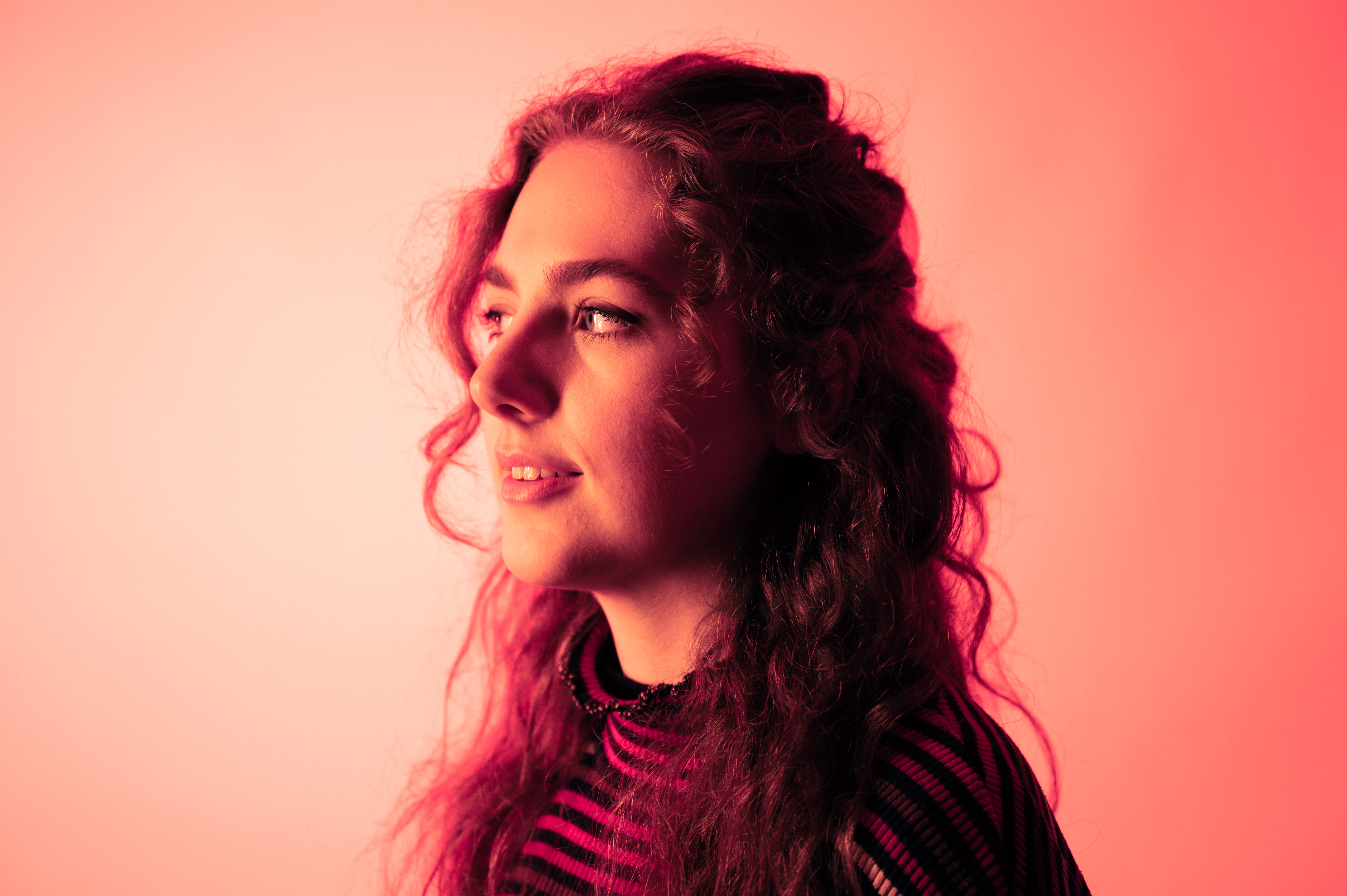 Side profile of a student with long curly hair